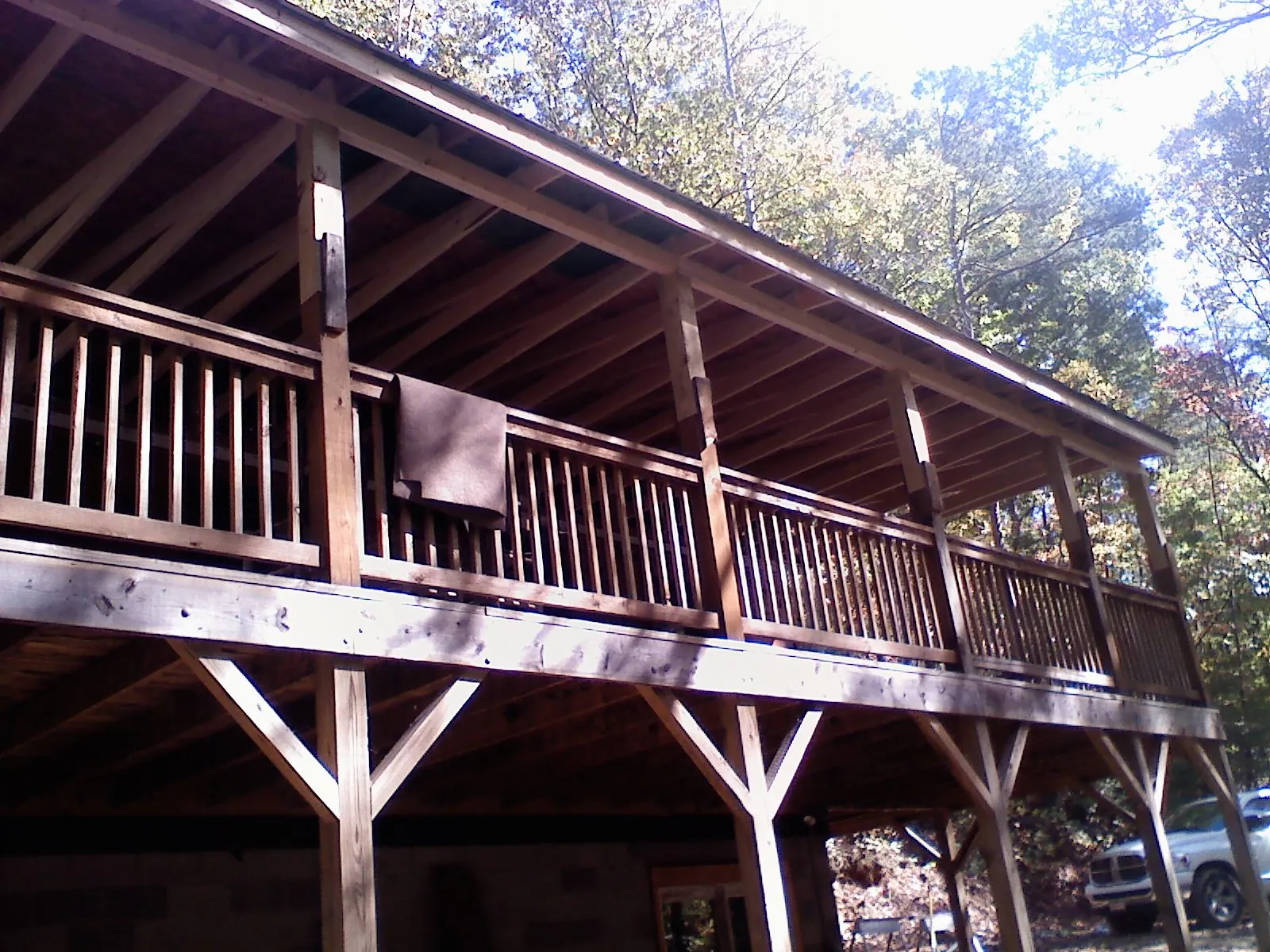 Timber framing under a new elevated porch and deck — Roof Leak Repair in Arvada by Roofing Brothers